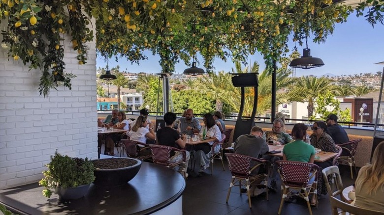 Diners on the upstairs patio at Truly Pizza in Dana Point, California