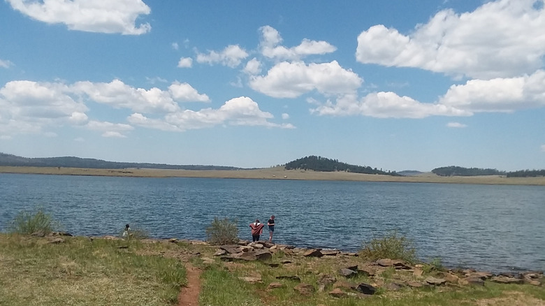 Beachgoers on the shore of Big Lake