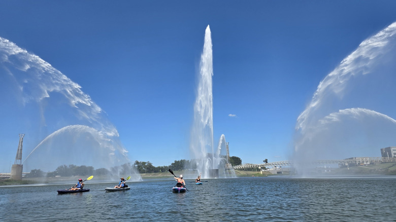Five Rivers Fountains of Light at RiverScape MetroPark in Dayton, Ohio, with kayakers on the water