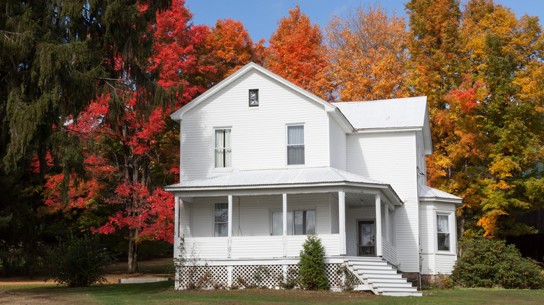 Beautiful white house surrounded by colorful trees in Accident, Maryland