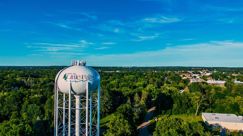 Water tower, green trees and small town