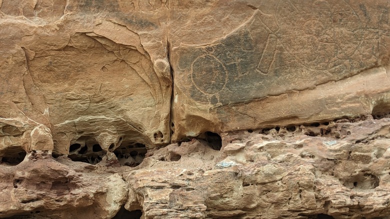 Native American rock art etched on sandstone at Medicine Lodge Archaeological Site, Wyoming