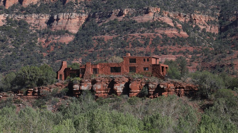 Adobe House of Apache Fire with colorful rocks at Red Rock State Park