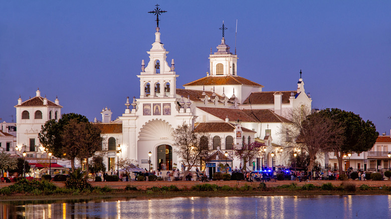 View of a church in El Rocio during the evening hours from the waterfront