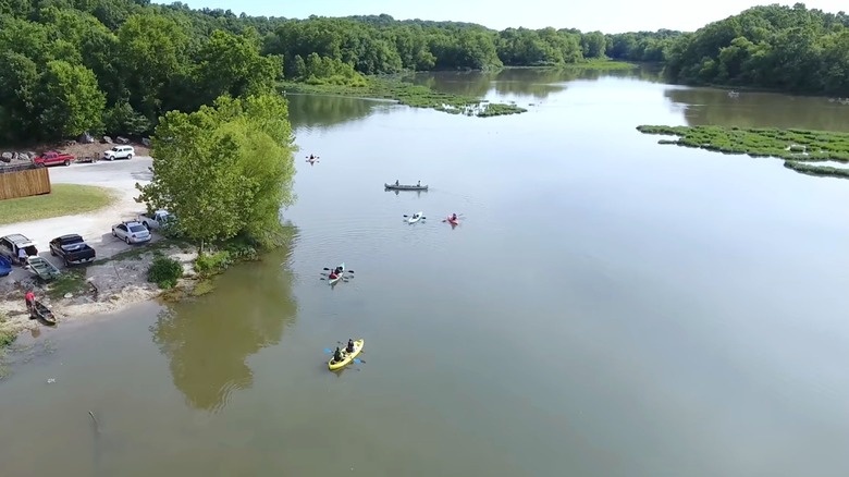 aerial view of Lake Springfield Park and Boathouse with people paddling in the water, Missouri