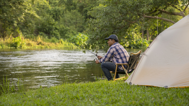 Camper and fisherman enjoying some time along the lake.