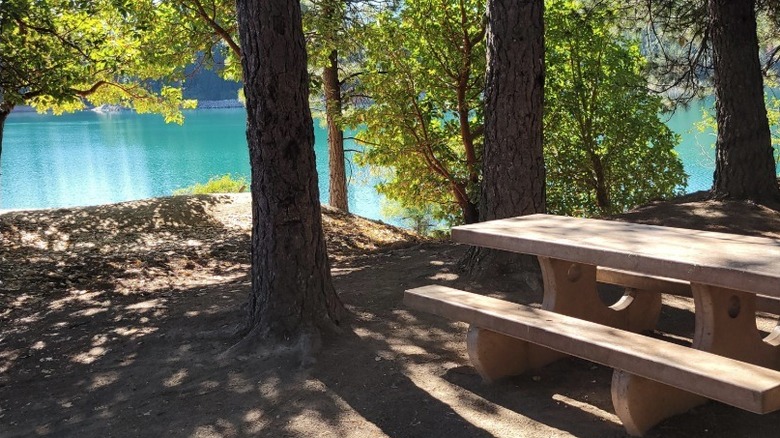 A picnic table at the Sly Creek Campground overlooking the Sly Creek Reservoir.