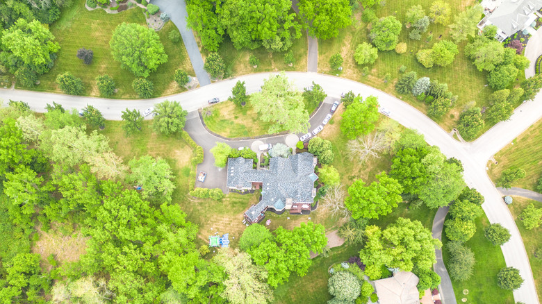Aerial view of a residential area in Flourtown, Pennsylvania during the day with roadways and driveways shown.