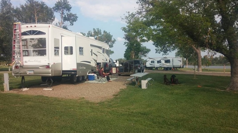 Two RVs parked at campsites