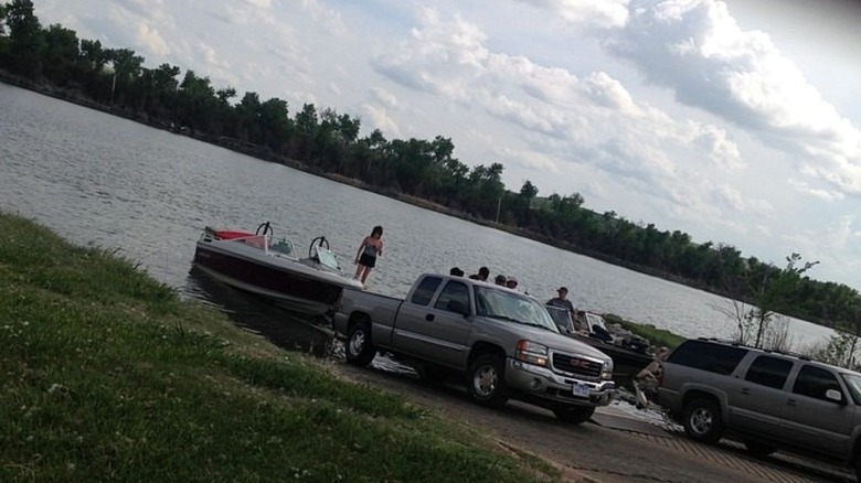 trucks at boat ramp putting boats in the water