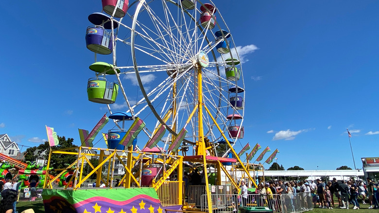 Carnival rides, including a Ferris wheel at the Norwalk Oyster Festival.