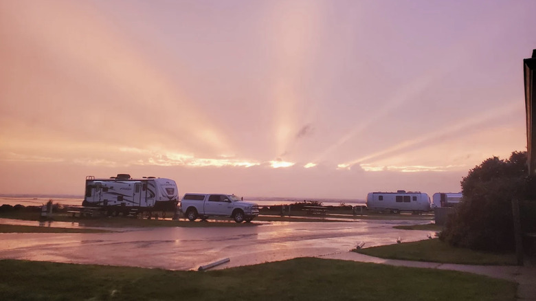 RVs parked at Pacific Beach State Park Campground at sunset