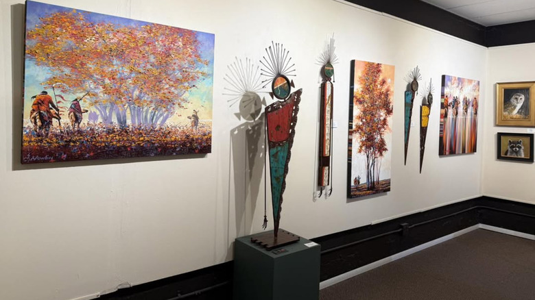 Paintings and sculptures displayed in Corrales Bosque Gallery