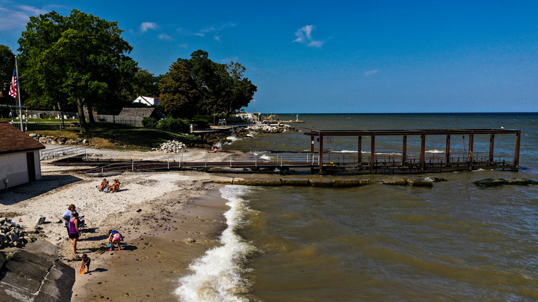 Kids and parents on beach near boat ramp in Avon Lake, Ohio