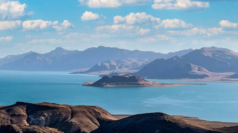 Barren hills surround Pyramid Lake, a high desert lake with aquamarine waters in Nevada
