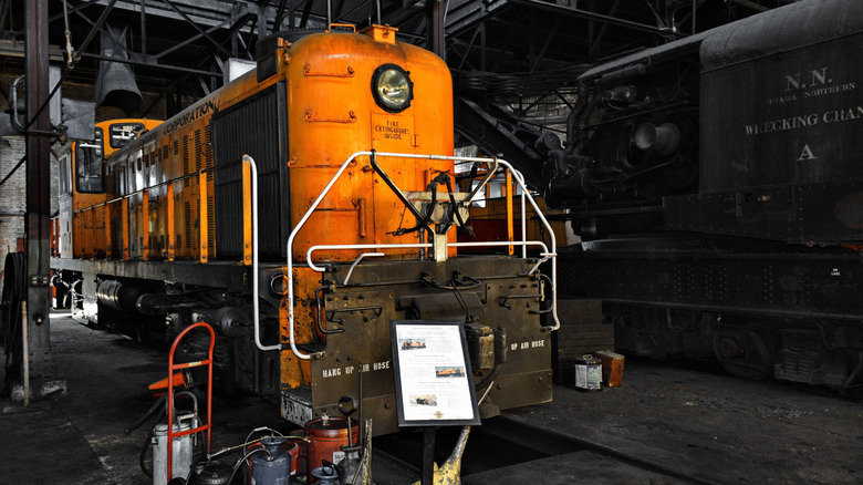 An orange train car in the Nevada Northern Railway Museum