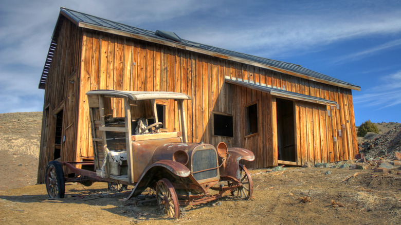 Old rusted car and weathered building at Berlin, Nevada