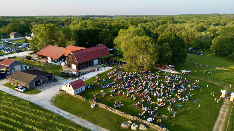 Aerial view of Westport Rivers Vineyard & Winery, with many people outside