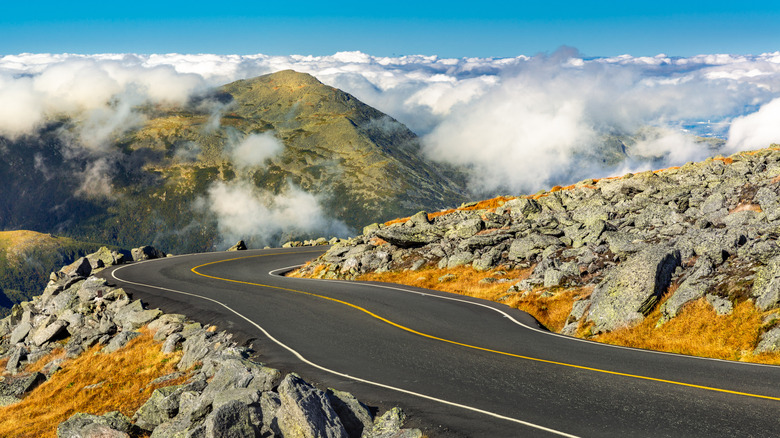 A road descends the cloud-shrouded slopes of Mount Washington, New Hampshire