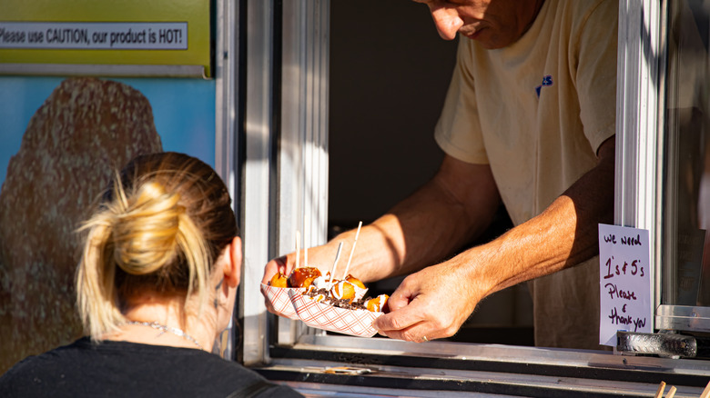 Food truck serving customer