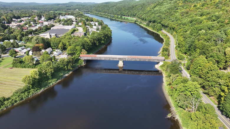 An aerial view of the Cornish Windsor Covered Bridge and the Connecticut River