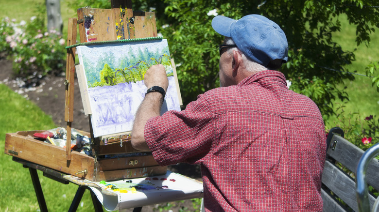Artist painting at the rose garden in West Hartford