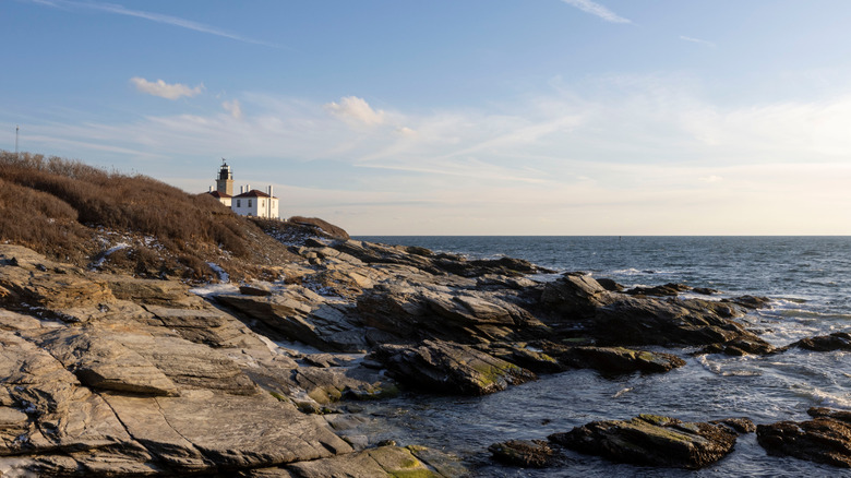 Beavertail Lighthouse overlooking rocky shores in Rhode Island