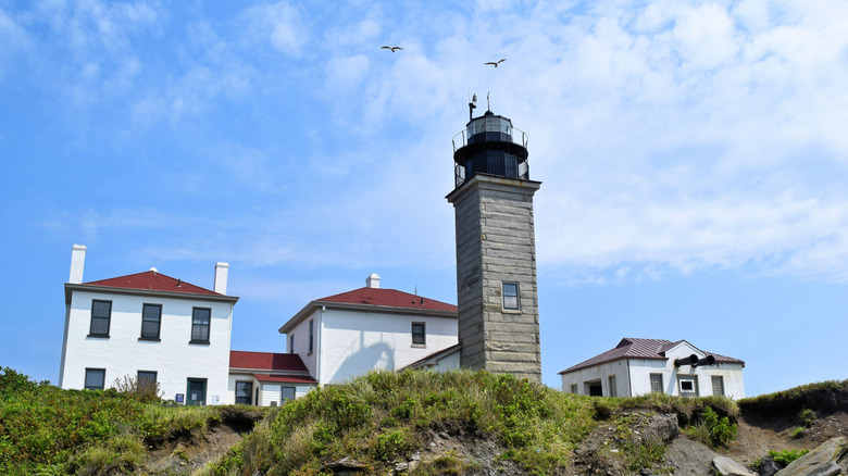 The Beavertail Lighthouse on a rugged shore in Rhode Island