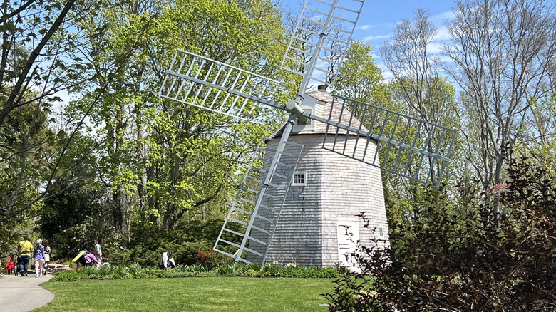 An old-fashioned windmill stands in the middle of Heritage Museums & Gardens in Massachusetts