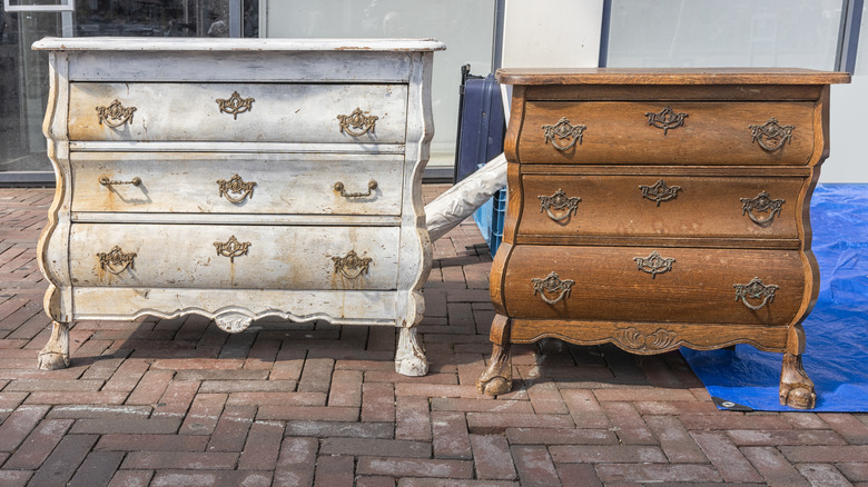 Two antique dressers outside