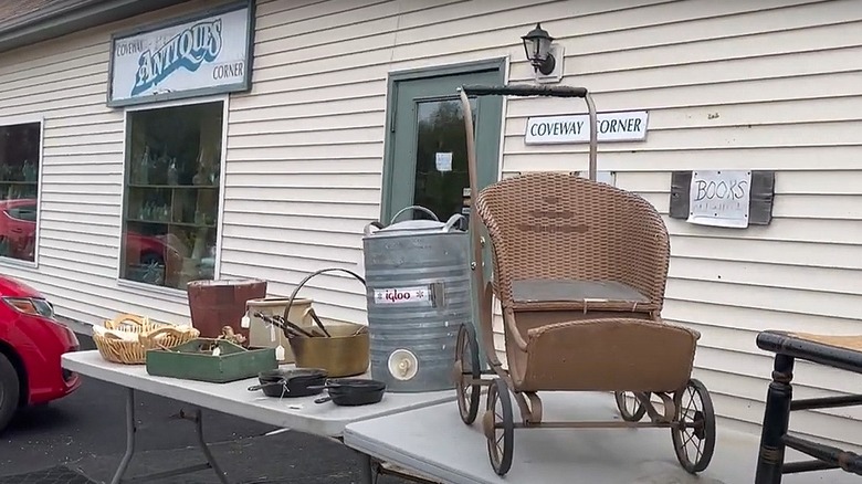 Items on a table in front of Coveway Corner antique shop