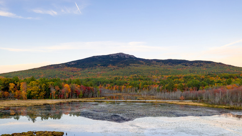 Views of Mount Monadnock and a pond during autumn
