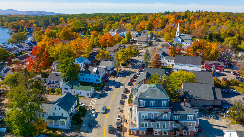 Aerial view of fall foliage on Main Street in Wolfeboro, New Hampshire's historic town center at Lake Winnipesaukee.
