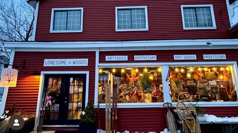 The storefront of Lonesome Woods Vintage and Antiques on Main Street in Bethlehem, New Hampshire in the winter