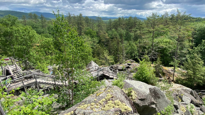 Wood staircases zigzag down massive boulders at the Polar Caves, New Hampshire