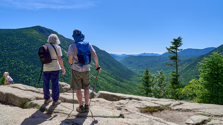 Hikers at an overlook in the White Mountain National Forest