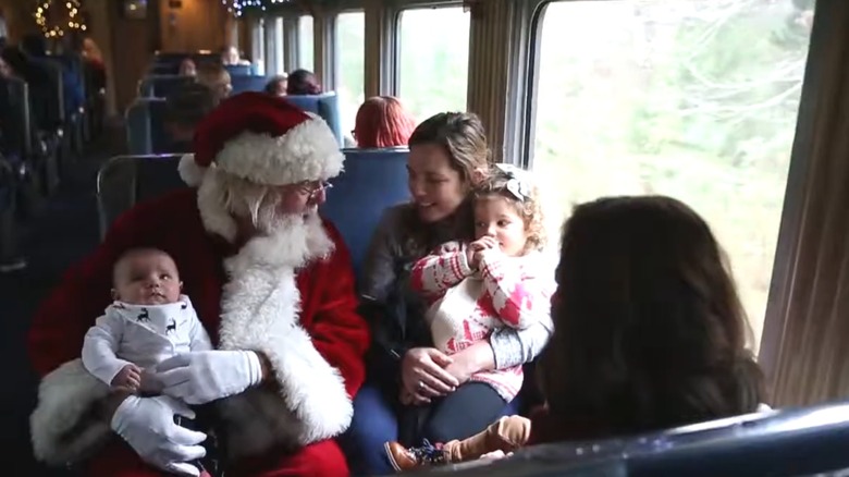 Santa Claus on the Seashore Line talking to families