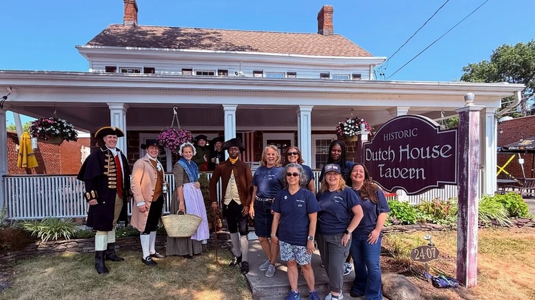 Employees standing outside the Dutch House Tavern in Fair Lawn