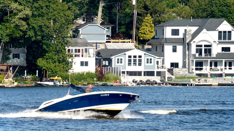 Boat on Lake Hopatcong, New Jersey, with houses in the background