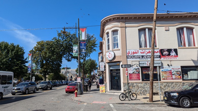 A street scene of South Paterson with signs in Arabic