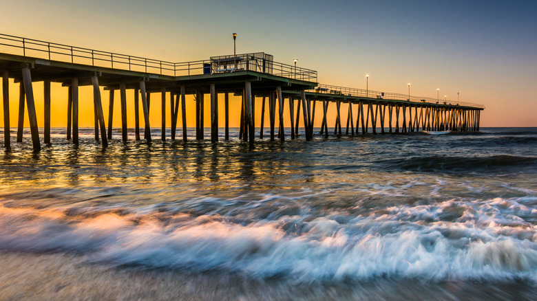 Ventnor City Fishing Pier in New Jersey seen from the shoreline during sunset