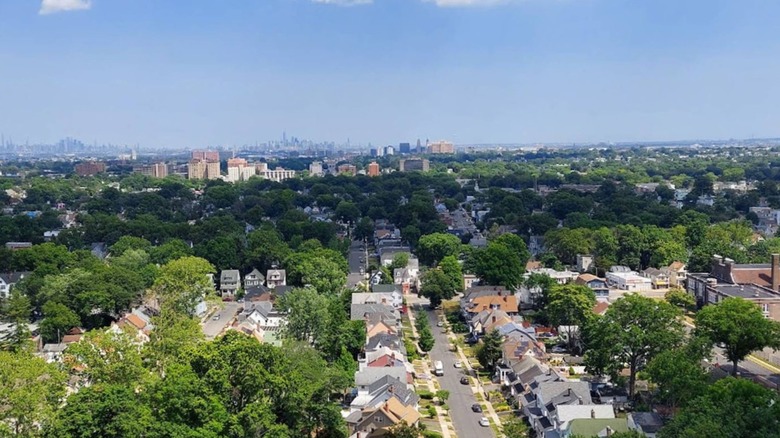 Aerial view of Harrison, New Jersey, with the New York City skyline in the background under a blue sky