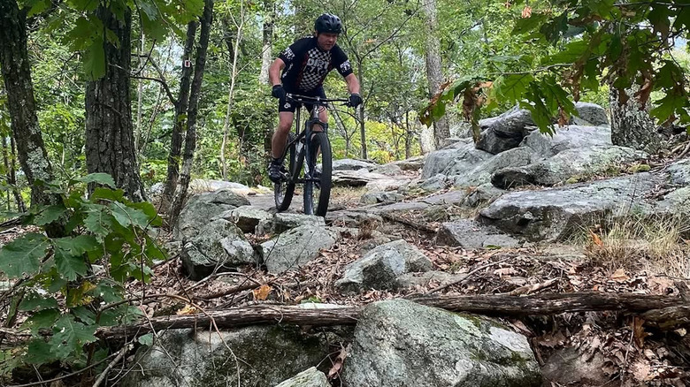 A mountain biker explores a rugged trail in Ringwood State Park