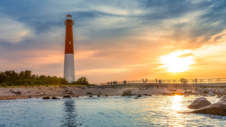 Barnegat Lighthouse and shore of Long Beach Island in New Jersey during sunset