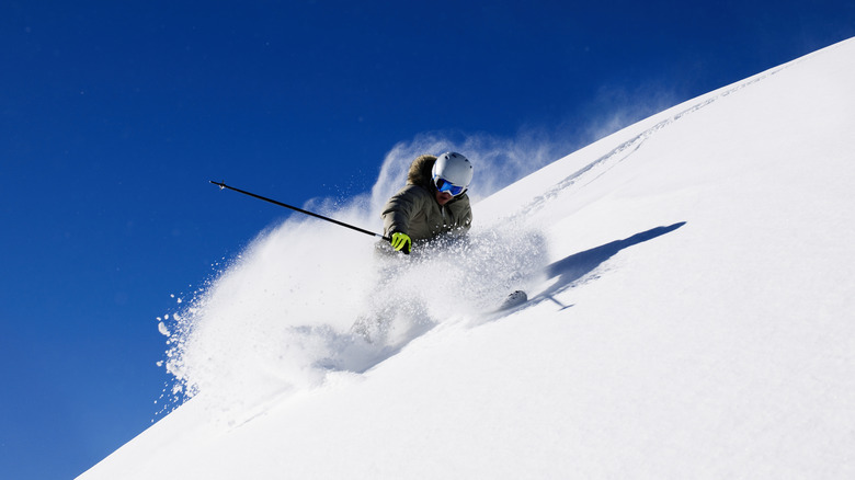 A skier in deep powder in Angel Fire, New Mexico