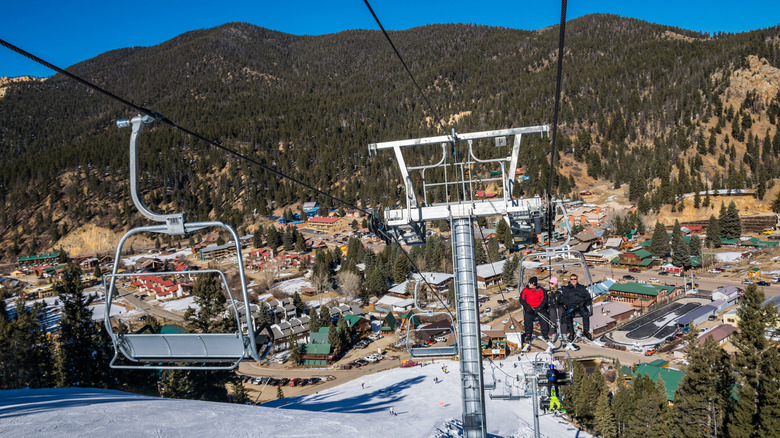 Skiers on a lift in Red River, New Mexico