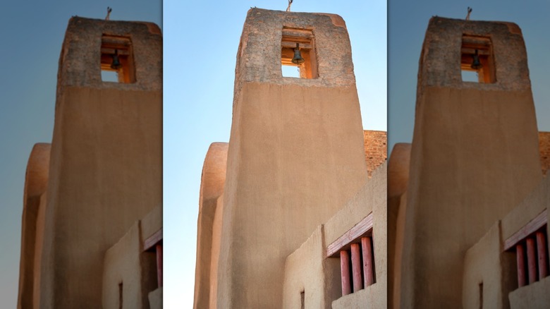 San Estevan del Rey Mission tower against blue sky