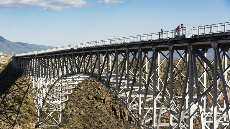 People standing on the Rio Grande Gorge Bridge in New Mexico