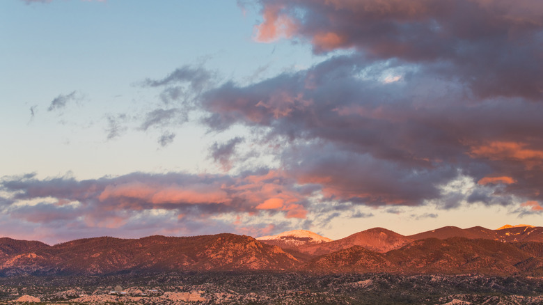 Sun sets over Sangre de Cristo Mountains in Tesuque, New Mexico.