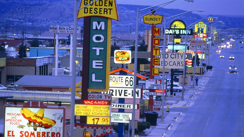 Neon-lit stretch of Route 66 running through Gallup, New Mexico at night